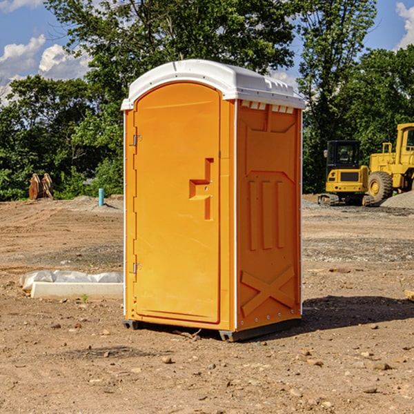 what is the cost difference between standard and deluxe portable toilet rentals in New Midway